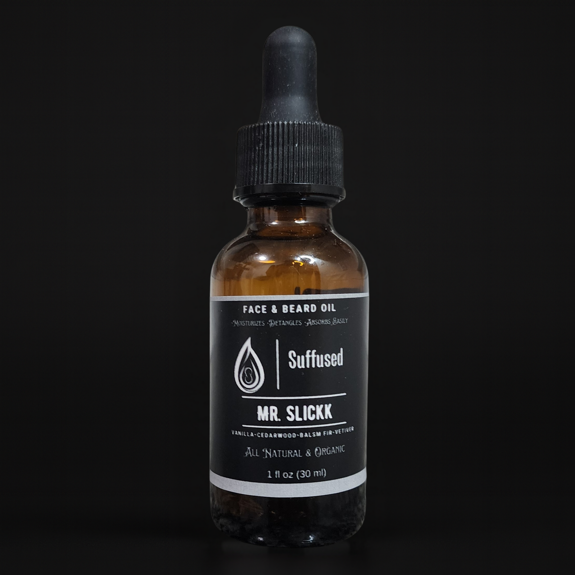 Brown glass bottle with black dropper labeled 'Suffused Mr. Slickk' on a black background