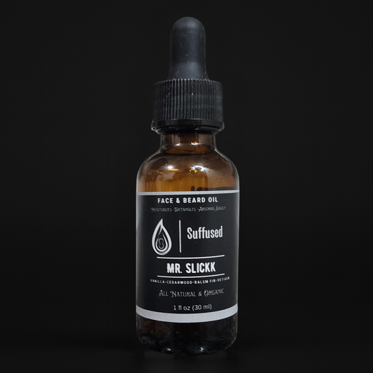 Brown glass bottle with black dropper labeled 'Suffused Mr. Slickk' on a black background